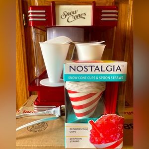 Nostalgia snow cone machine with paper cones 2 plastic cones and spoon.